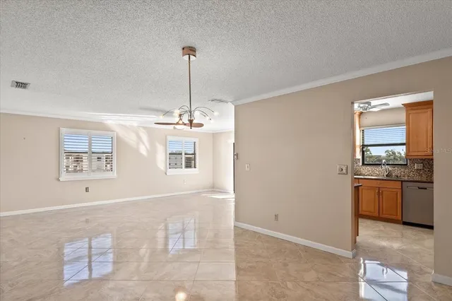 a view of a kitchen with a sink cabinets and a window