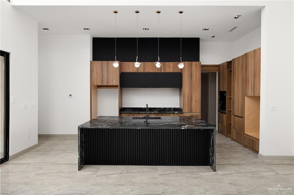 1402 Tierra Encantada Weslaco, TX 78596 - Photo 10 of 29 a view of kitchen with stainless steel appliances granite countertop cabinets and window