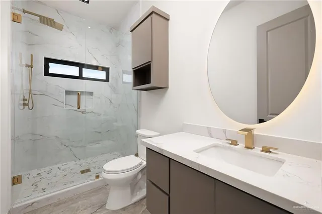a view of a closet area with wooden floor