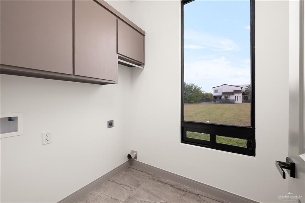 1402 Tierra Encantada Weslaco, TX 78596 - Photo 25 of 29 a view of a closet area with wooden floor