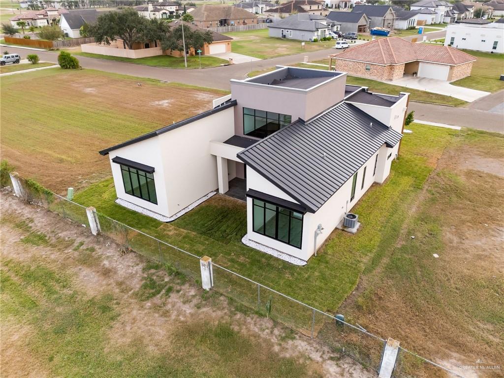 1402 Tierra Encantada Weslaco, TX 78596 - Photo 26 of 29 an aerial view of residential houses with outdoor space