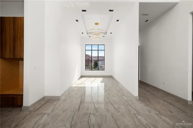 a living room with a large screen tv