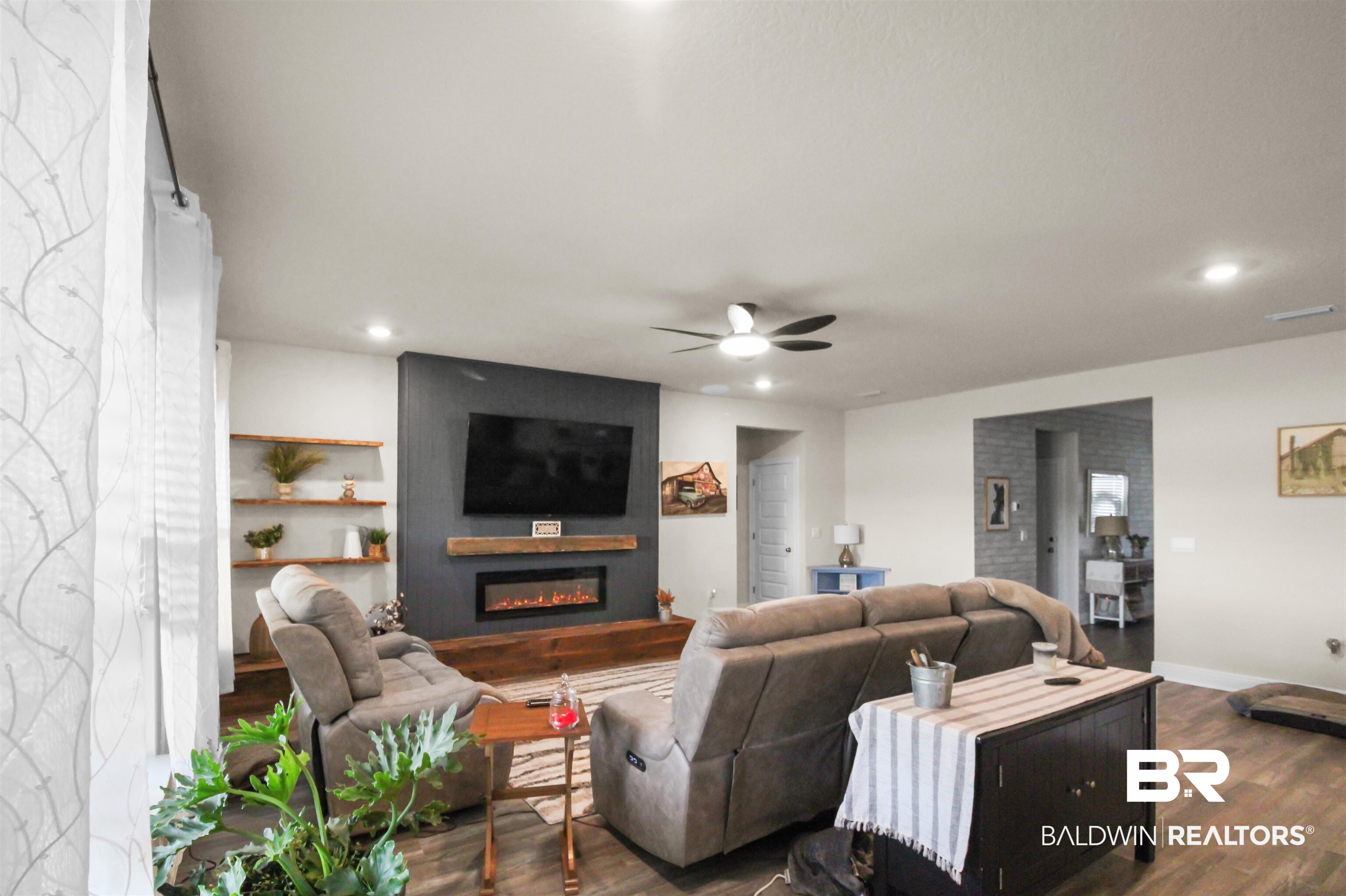 12523 Pheasant Run Elberta, AL 36530 - Photo 16 of 43 Living area with a large fireplace, wood finished floors, a ceiling fan, and recessed lighting