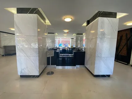 a kitchen with refrigerator and window