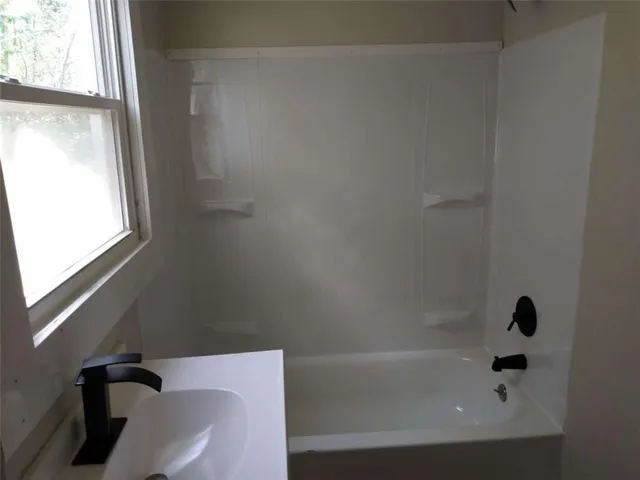 a bathroom with a bathtub