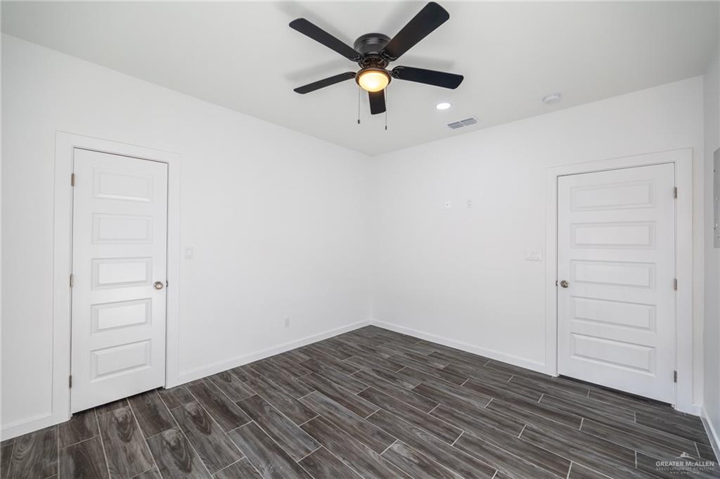 1106 Cooper Lane, Unit 3 San Juan, TX 78589 - Photo 12 of 17 wooden floor in an empty room