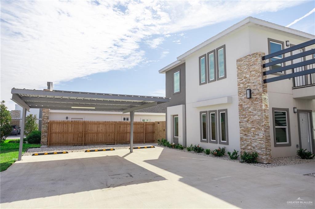1106 Cooper Lane, Unit 3 San Juan, TX 78589 - Photo 4 of 17 a front view of a house with a yard and garage