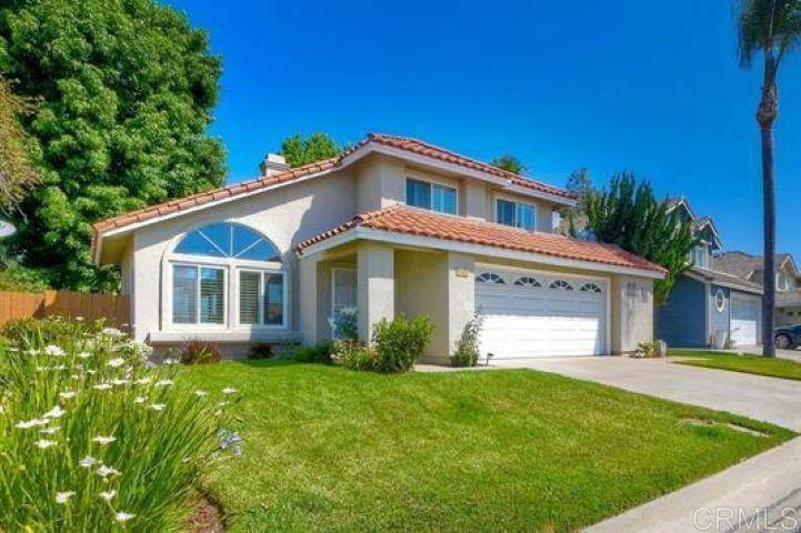 635 Boysenberry Way Oceanside, CA 92057 - Photo 2 of 21 a front view of a house with garden