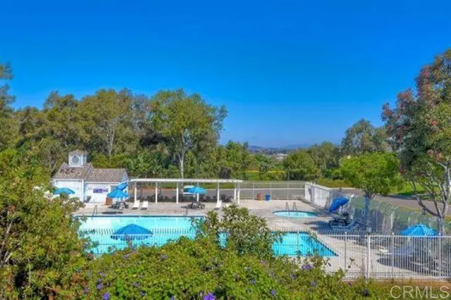 a view of a swimming pool with a patio