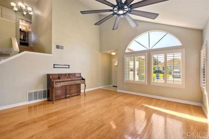 635 Boysenberry Way Oceanside, CA 92057 - Photo 3 of 21 a view of a livingroom with a ceiling fan and window