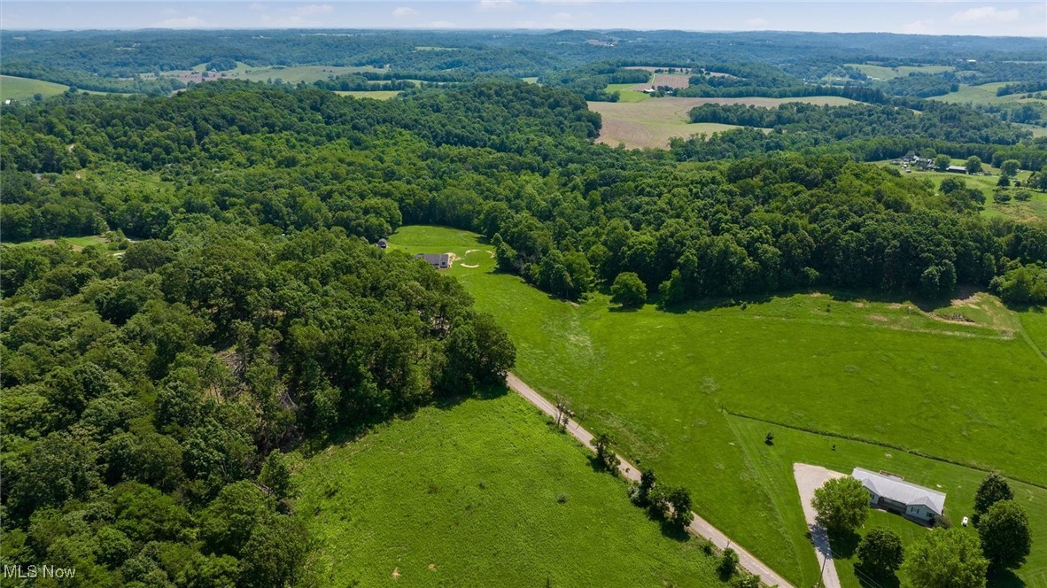 9910 Matchett Road Norwich, OH 43767 - Photo 38 of 48 Overview of rural landscape featuring a heavily wooded area