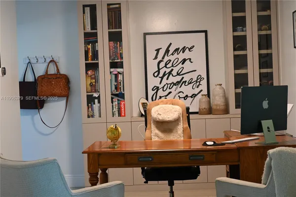 a view of a workspace with furniture