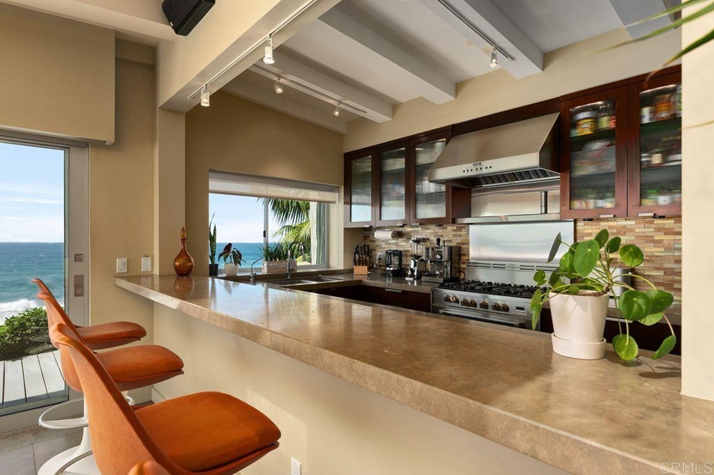 226 5th Street Encinitas, CA 92024 - Photo 11 of 45 a lobby with furniture and potted plant