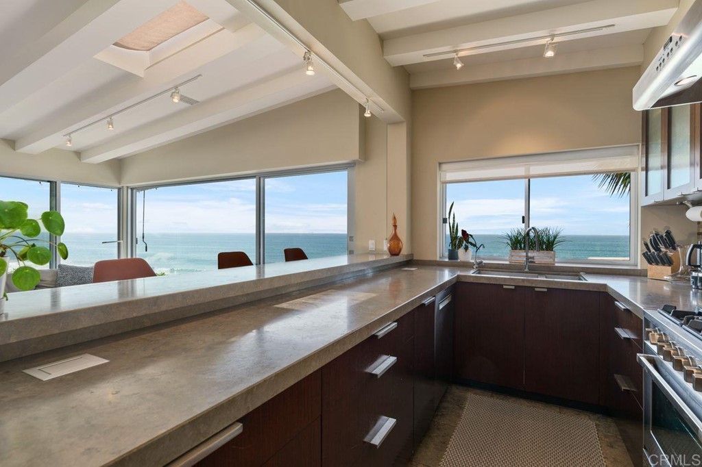 226 5th Street Encinitas, CA 92024 - Photo 13 of 45 a kitchen with a sink and large window