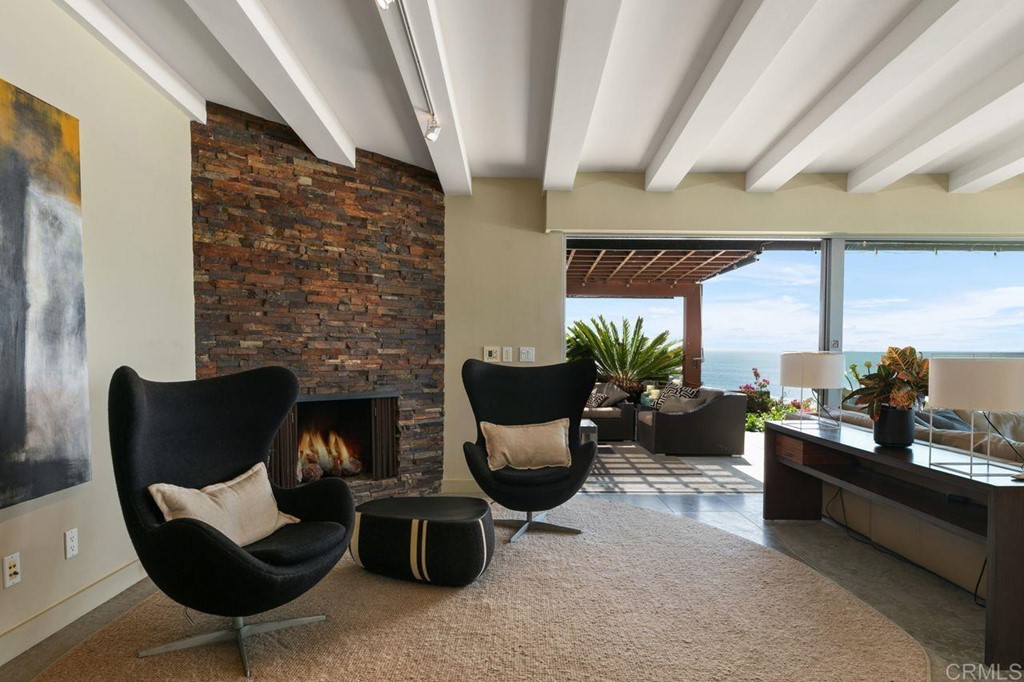226 5th Street Encinitas, CA 92024 - Photo 15 of 45 a living room with furniture and a fireplace