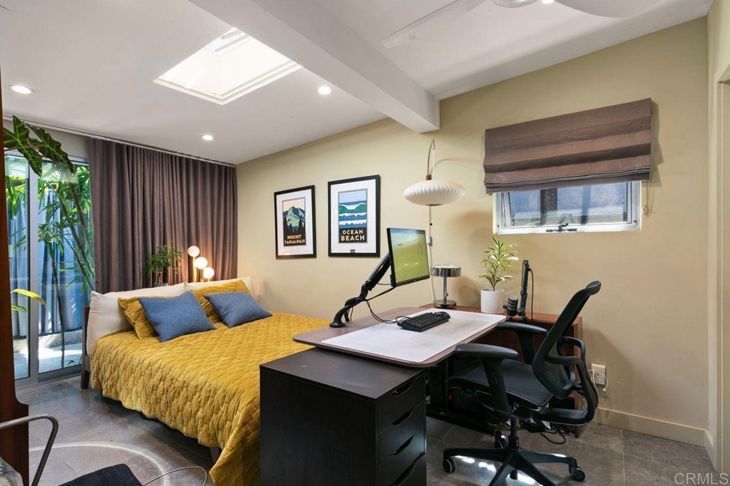 226 5th Street Encinitas, CA 92024 - Photo 28 of 45 a bedroom with a bed and wooden floor