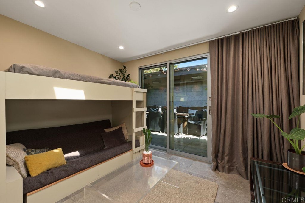 226 5th Street Encinitas, CA 92024 - Photo 29 of 45 an empty room with wooden floor and a fireplace