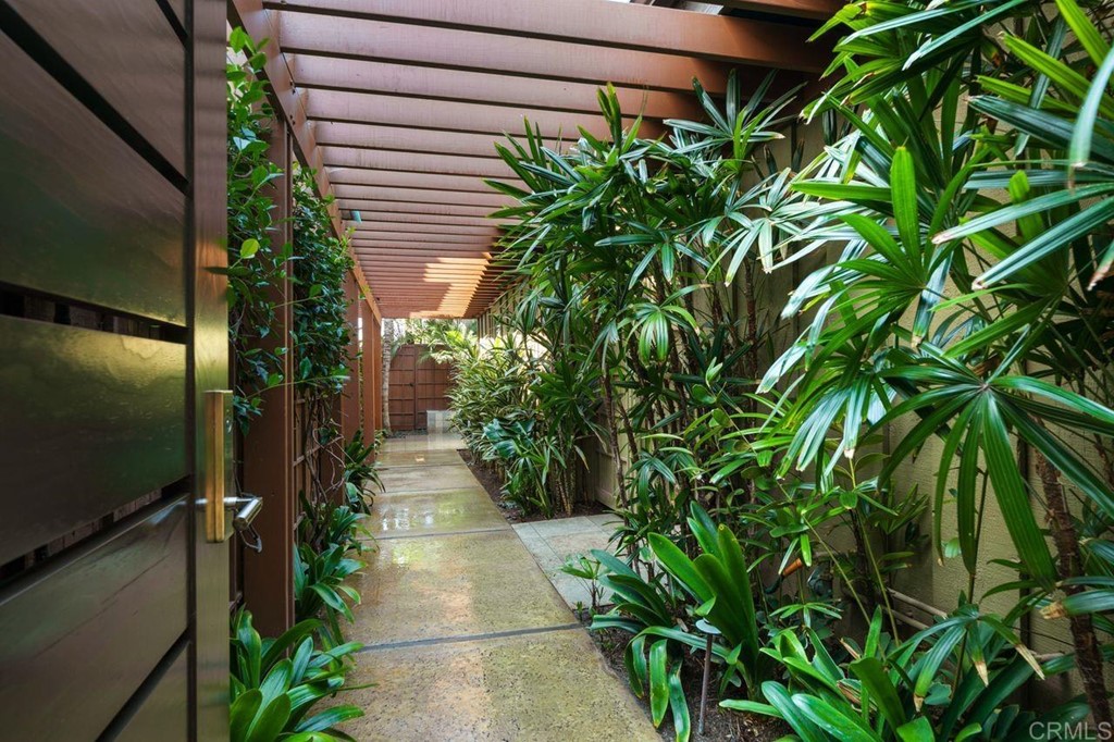 226 5th Street Encinitas, CA 92024 - Photo 4 of 45 a entryway with flower plants