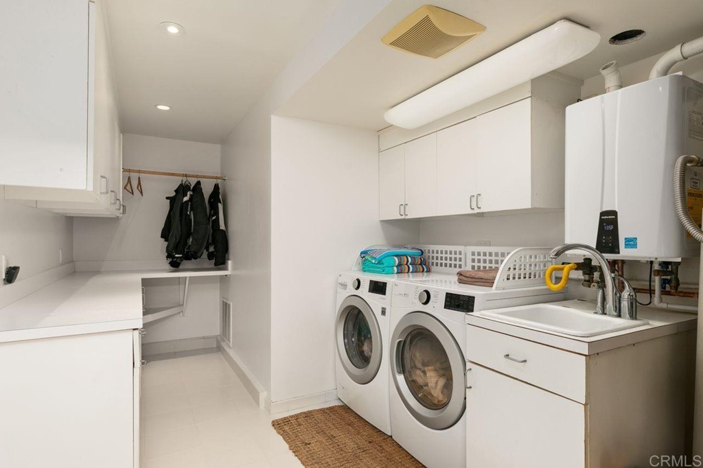 226 5th Street Encinitas, CA 92024 - Photo 39 of 45 a utility room with sink dryer and washer
