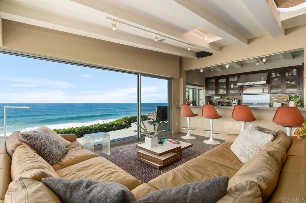 226 5th Street Encinitas, CA 92024 - Photo 7 of 45 a living room with furniture and a floor to ceiling window
