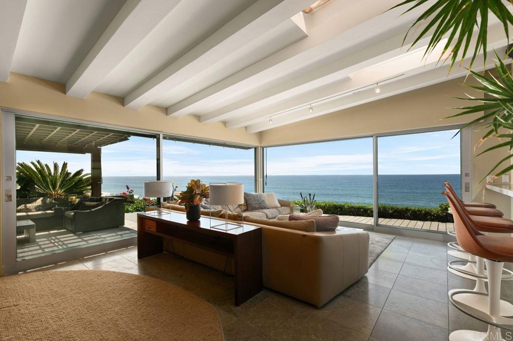 226 5th Street Encinitas, CA 92024 - Photo 10 of 45 a living room with furniture and floor to ceiling windows