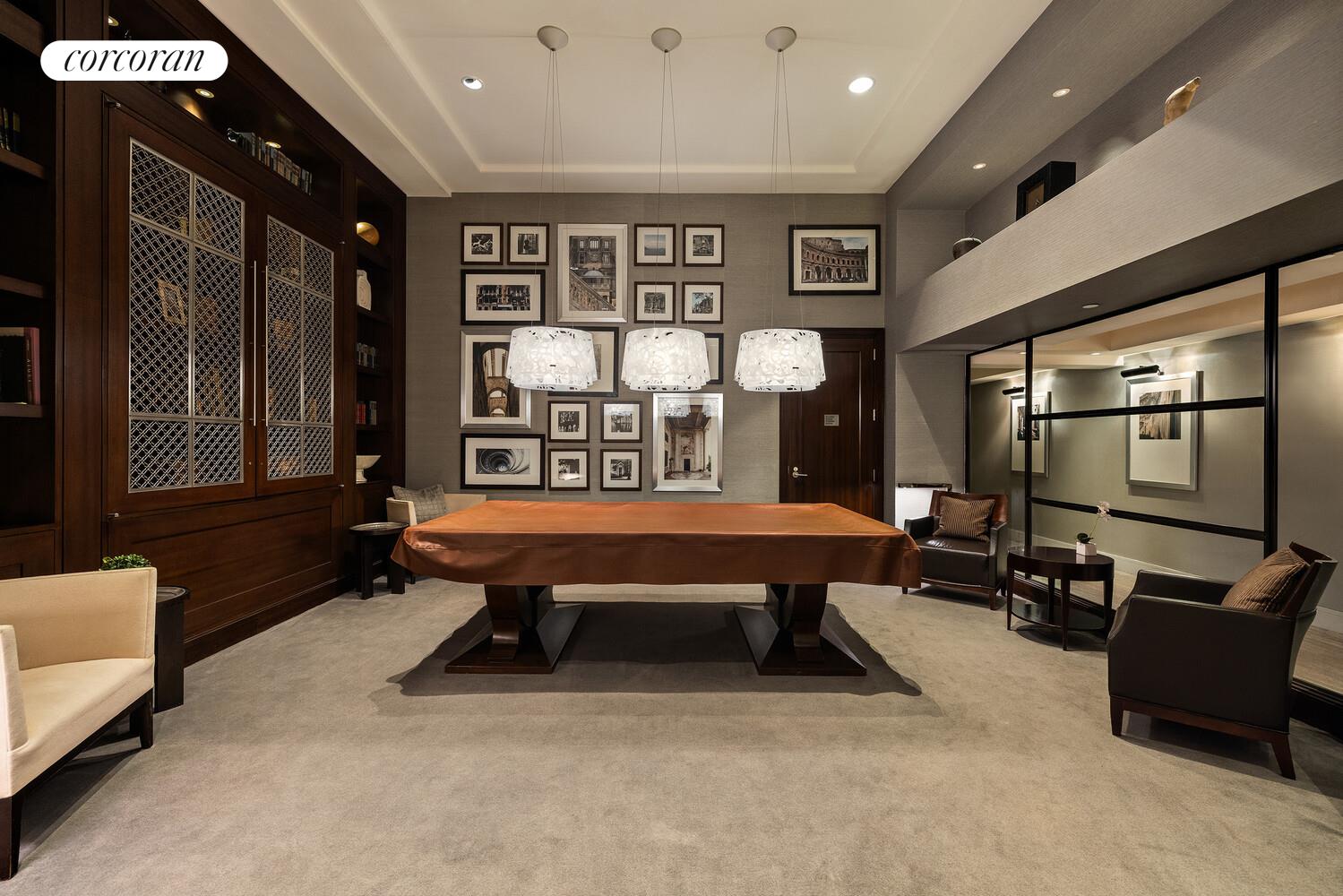 80 Riverside Boulevard, Unit 36B Manhattan, NY 10069 - Photo 21 of 25 a room with furniture pool table gym equipment mirrors and window