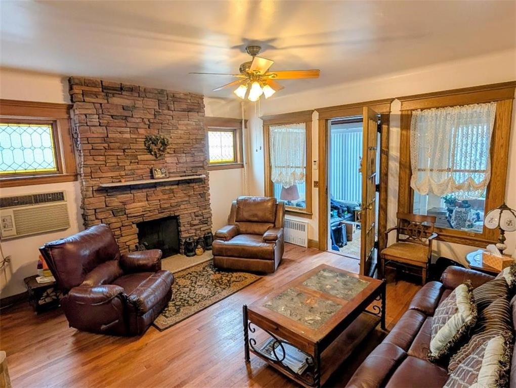 1735 West 11th Street Brooklyn, NY 11223 - Photo 2 of 14 a living room with furniture and a fireplace