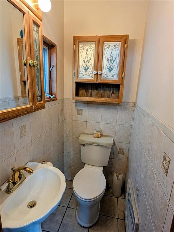 1735 West 11th Street Brooklyn, NY 11223 - Photo 7 of 14 a bathroom with a toilet and a sink
