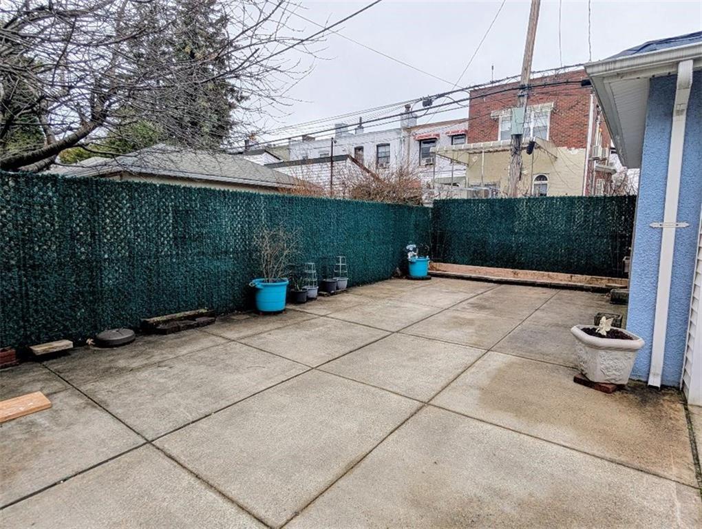 1735 West 11th Street Brooklyn, NY 11223 - Photo 9 of 14 a view of a street with potted plants