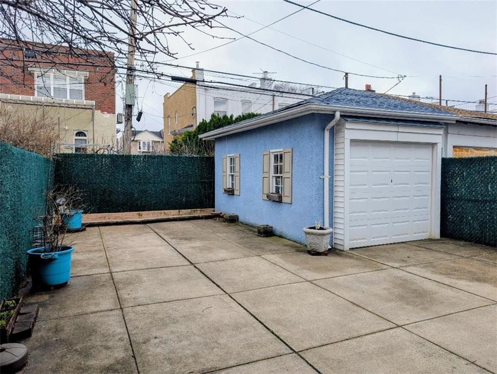 1735 West 11th Street Brooklyn, NY 11223 - Photo 10 of 14 a view of a house with a garage