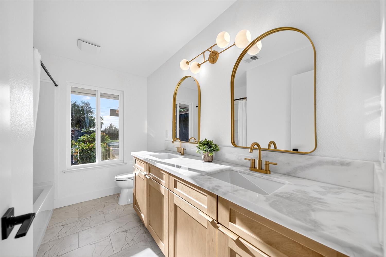 18578 Farallon Road Madera, CA 93638 - Photo 19 of 29 a spacious bathroom with a double vanity sink and a mirror