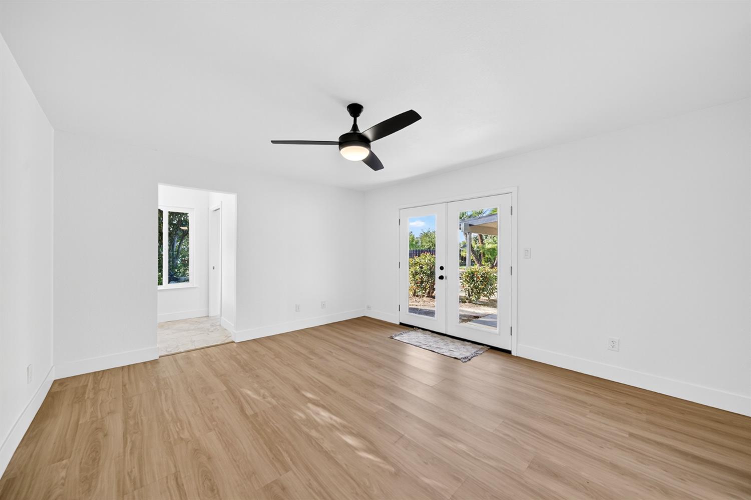 18578 Farallon Road Madera, CA 93638 - Photo 22 of 29 wooden floor in an empty room with a window