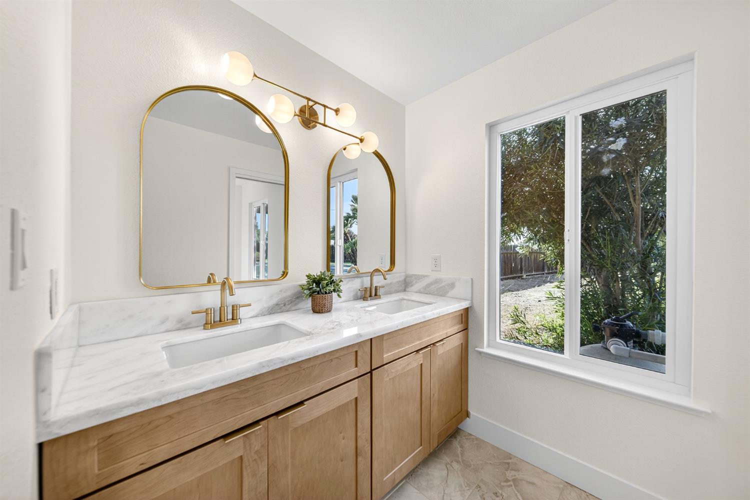 18578 Farallon Road Madera, CA 93638 - Photo 23 of 29 a bathroom with a double vanity sink and a large mirror