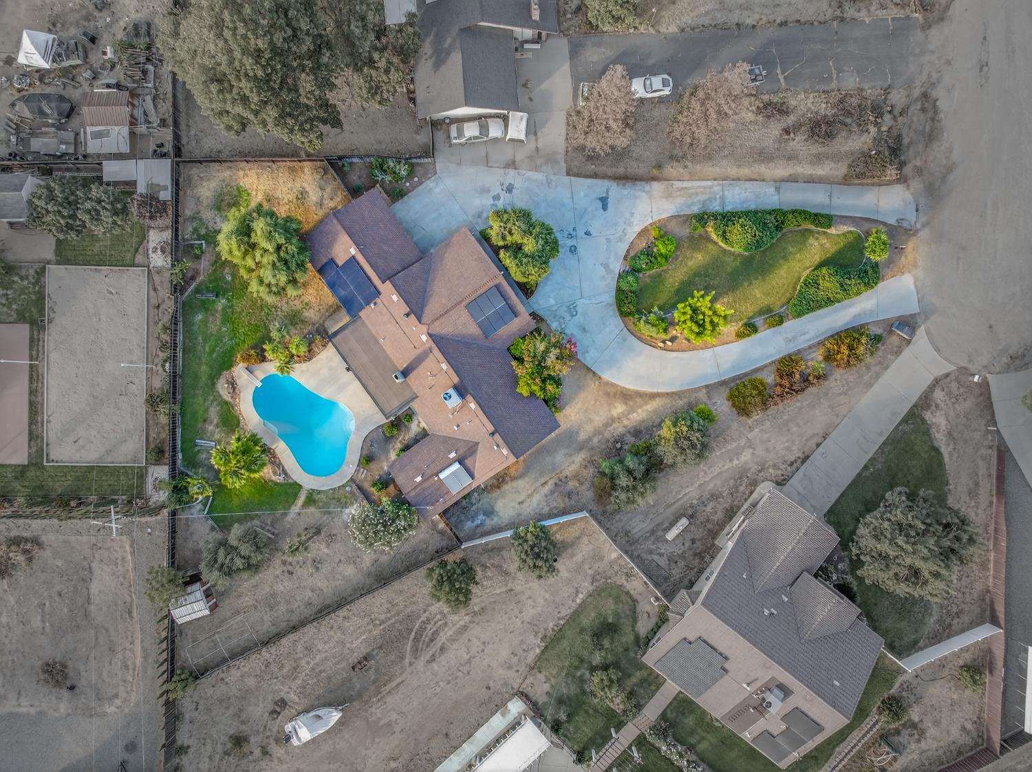 18578 Farallon Road Madera, CA 93638 - Photo 29 of 29 an aerial view of a house with garden space and a lake view