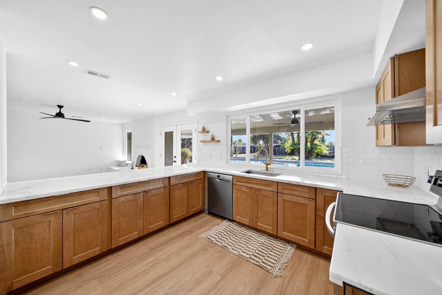 18578 Farallon Road Madera, CA 93638 - Photo 9 of 29 a large kitchen with cabinets a sink and dishwasher