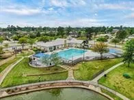 a view of a swimming pool with a yard