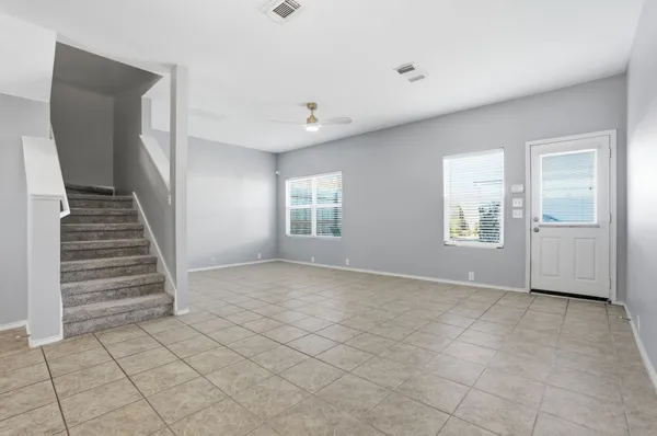 a view of an empty room with windows