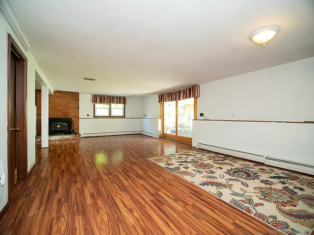 a view of an empty room and window