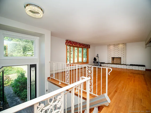 a view of a living room and balcony