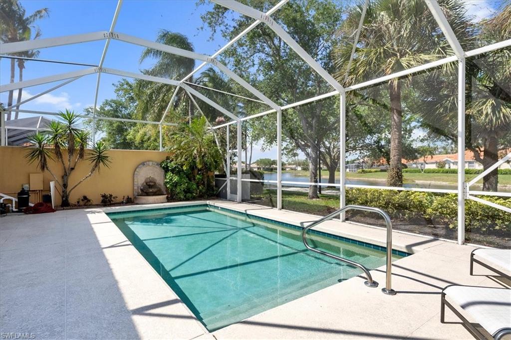 3060 Ellice Way Naples, FL 34119 - Photo 24 of 31 Pool with a lanai and a patio area