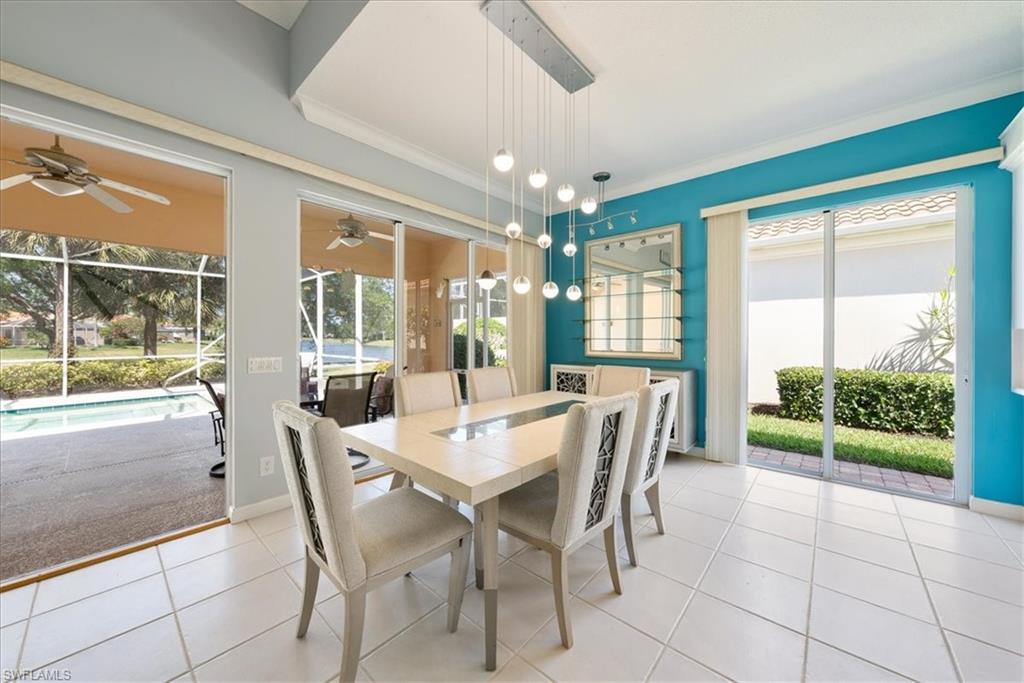3060 Ellice Way Naples, FL 34119 - Photo 8 of 31 Dining space with tile patterned floors, plenty of natural light, crown molding, and ceiling fan