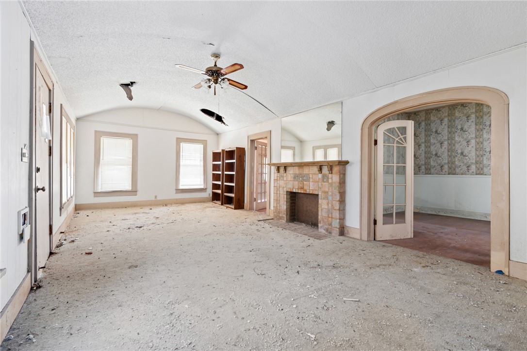 306 East Adams Street Itasca, TX 76055 - Photo 4 of 29 a view of a livingroom with a fireplace