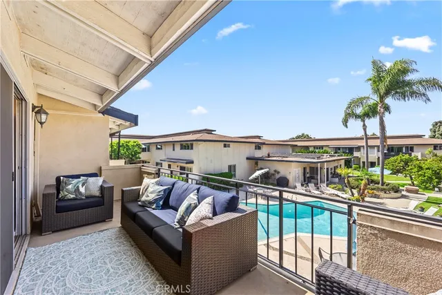 a view of a balcony with furniture