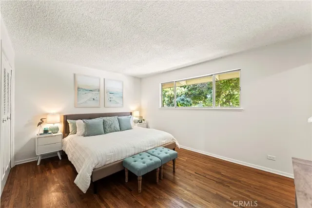 a bed room with a bed and a window