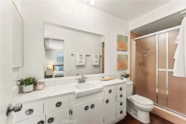 a bathroom with a sink toilet and shower