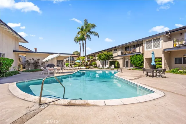 a view of a swimming pool with a patio