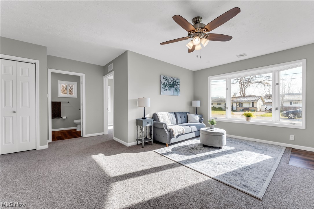 7501 Southland Road Mentor, OH 44060 - Photo 8 of 21 Living room with dark colored carpet and ceiling fan