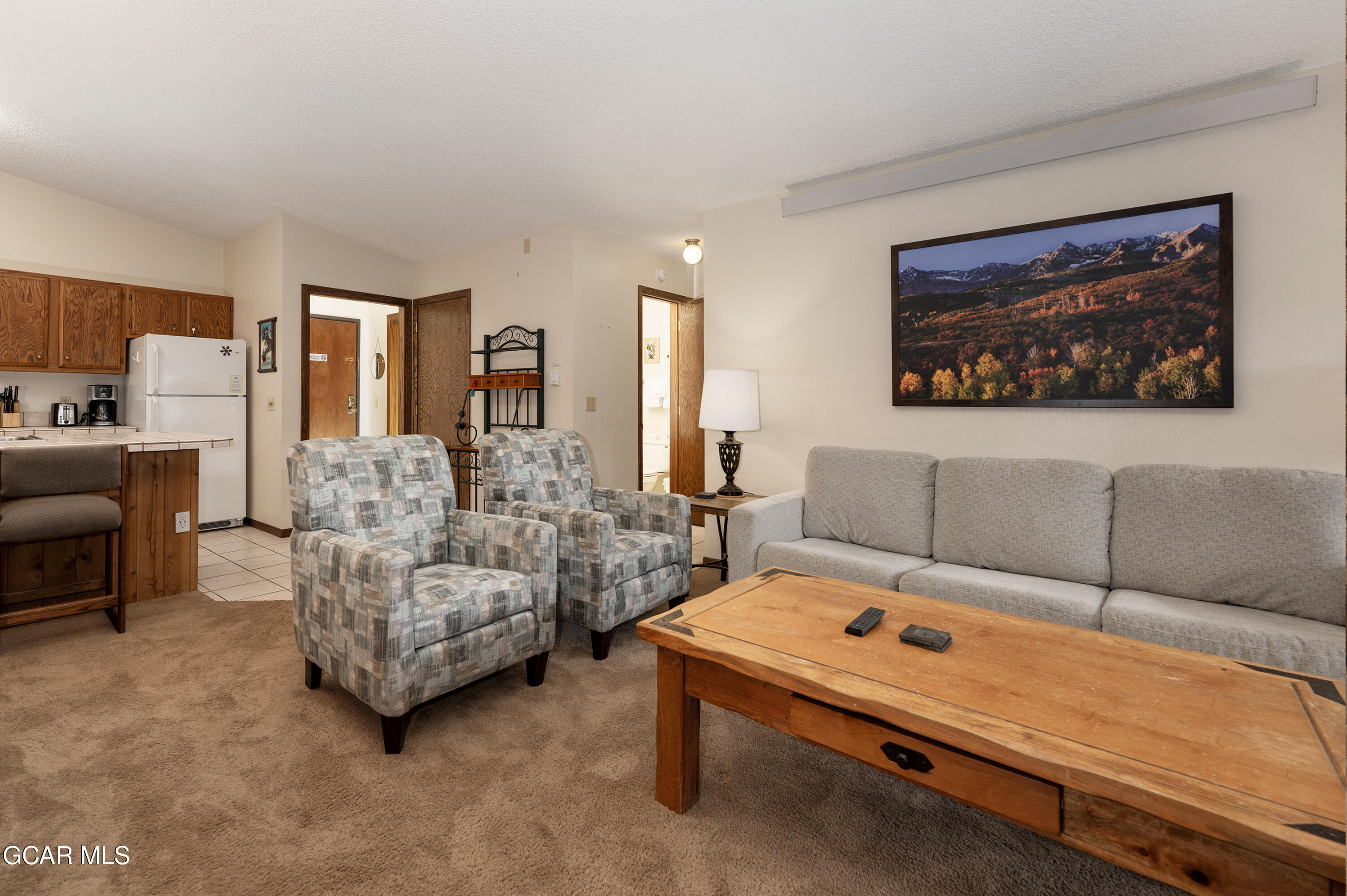 490 Kings Crossing Road, Unit 331 Winter Park, CO 80482 - Photo 4 of 38 a living room with furniture and a couch