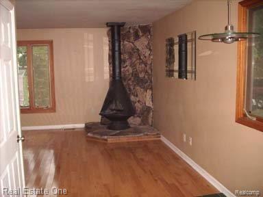 3431 Rush Lake Road Pinckney, MI 48169 - Photo 11 of 20 wood stove