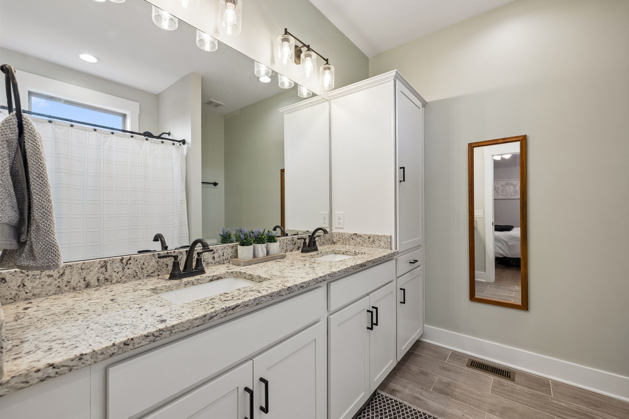 126 Julia Ann Court Springfield, TN 37172 - Photo 23 of 37 a bathroom with a granite countertop sink double and mirror